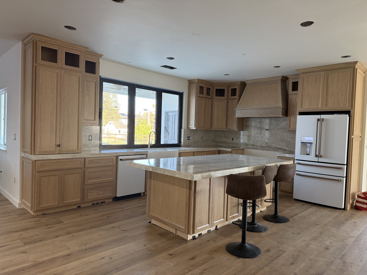 Kitchen with natural wood cabinets
